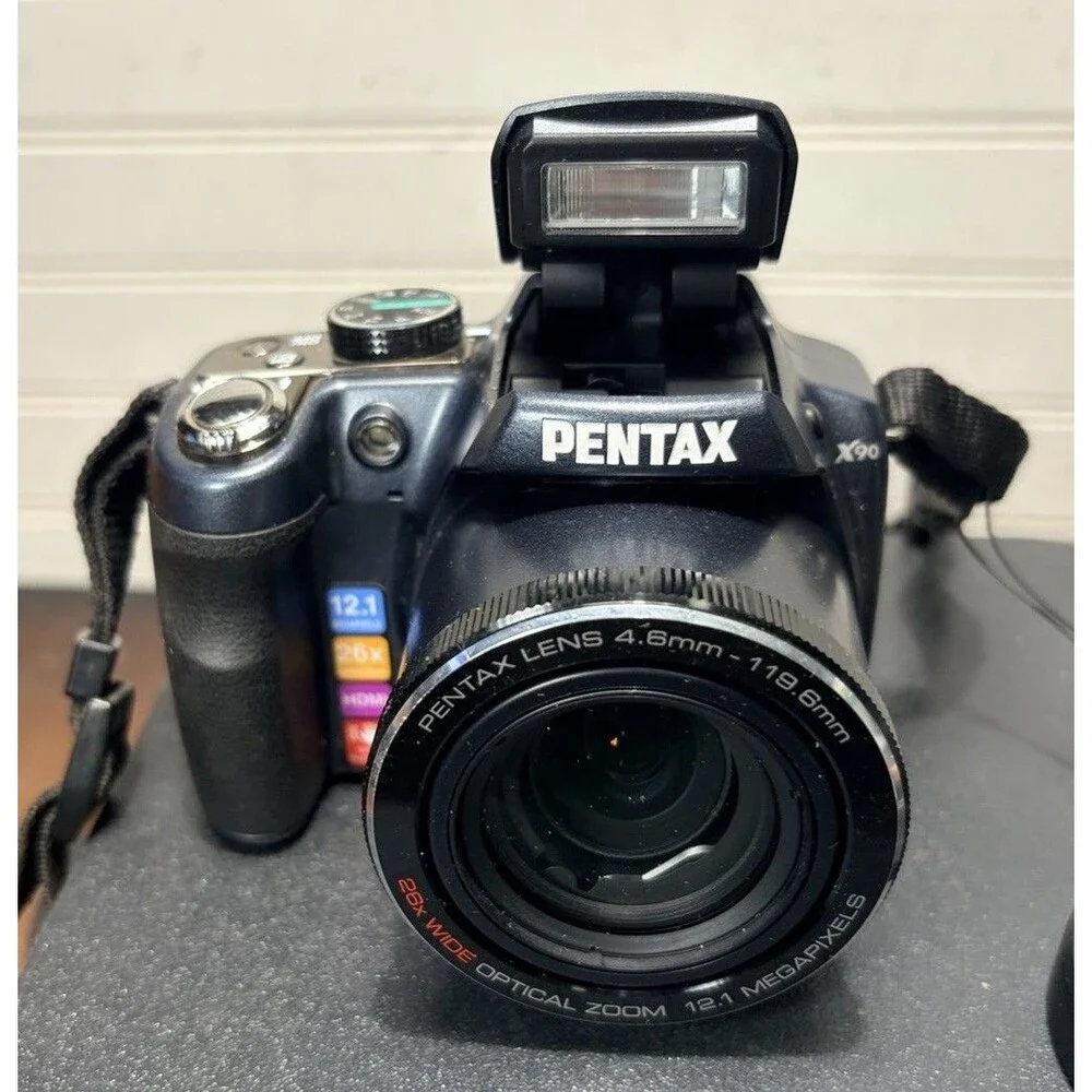 Pentax X90 12.1MP Digital Bridging Camera w/manual, Battery, Charger & Strap